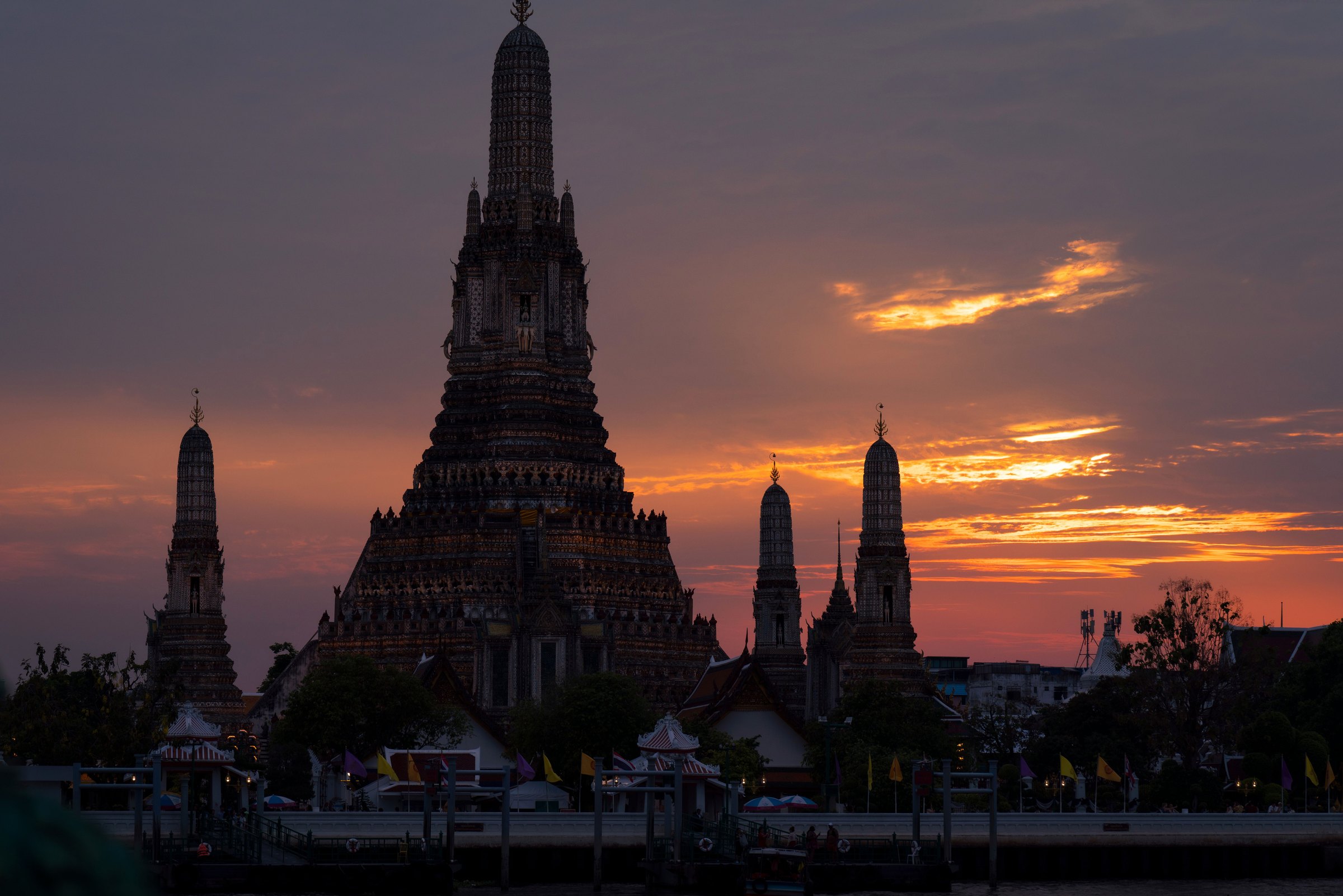 Wat Arun on the Chao Phraya river at sunset, Bangkok, Thailand
